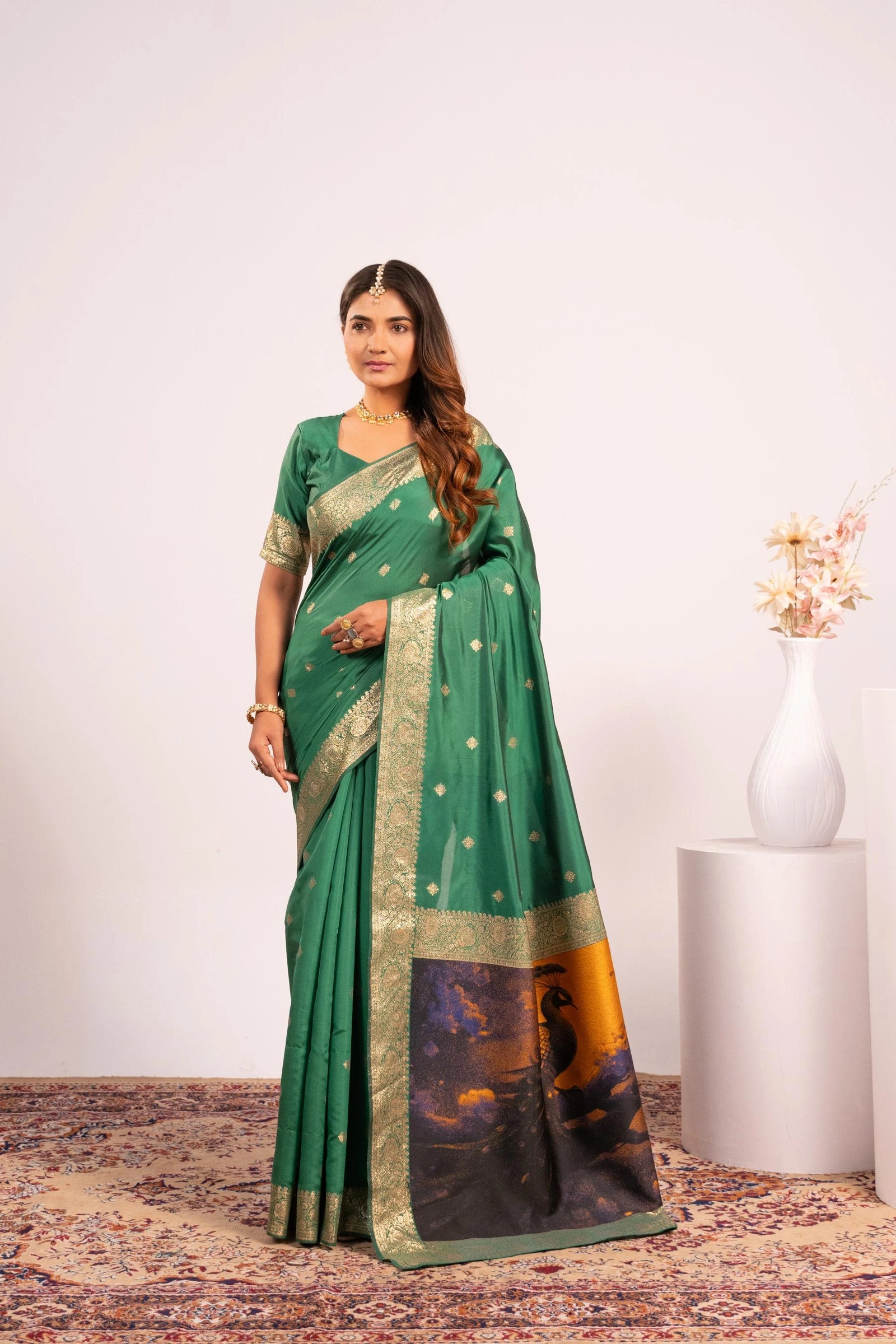 Woman wearing a green saree with a white background