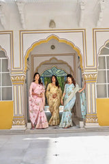 Sky Blue Thread Embroidered Jacquard Saree in a group walking shot