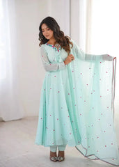 Sky Blue Anarkali Suit with Thread Embroidery – Model Holding Floral Booti Dupatta