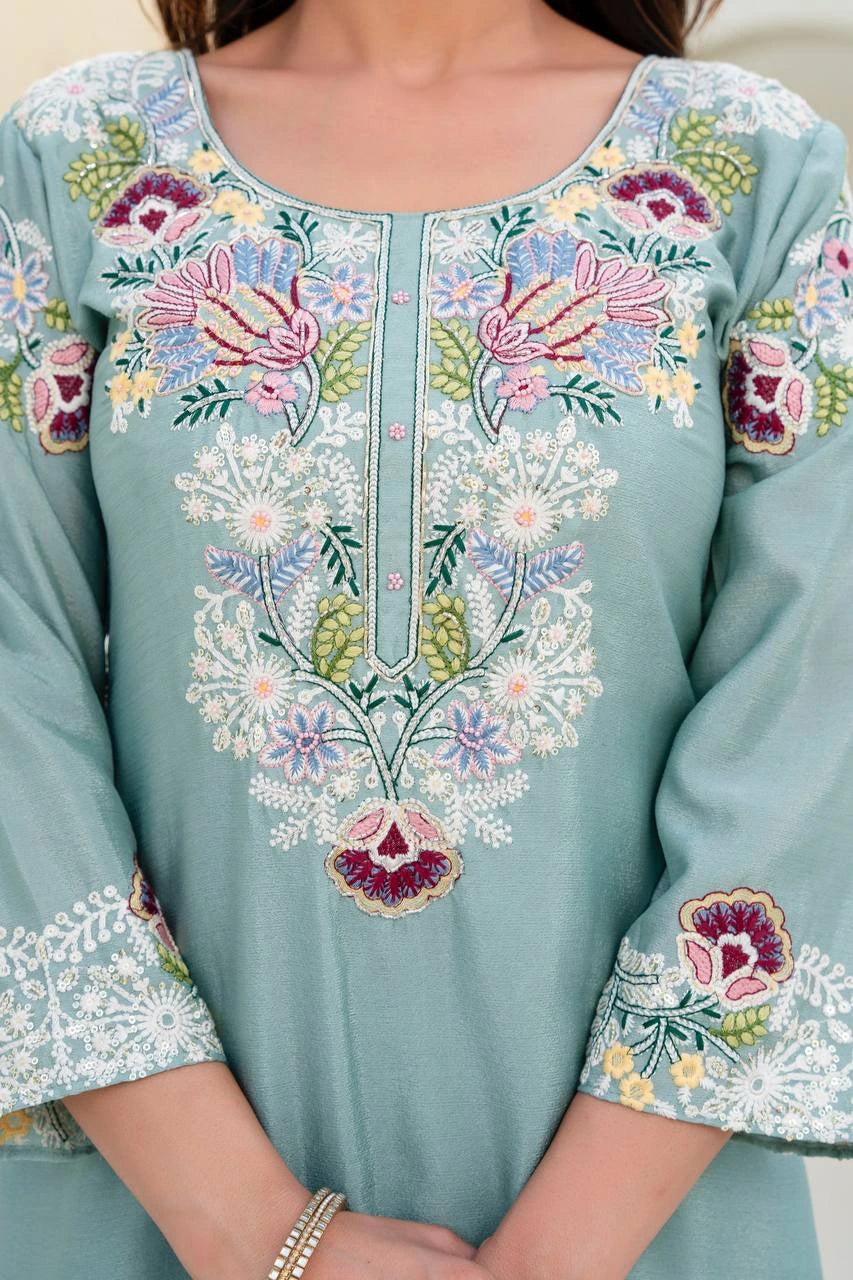 Light blue embroidered dress with floral patterns