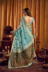 Woman in a traditional outfit with a decorative backdrop
