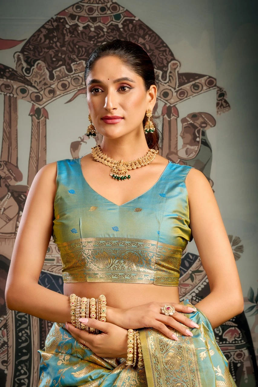 Woman in traditional attire with jewelry against a decorative background