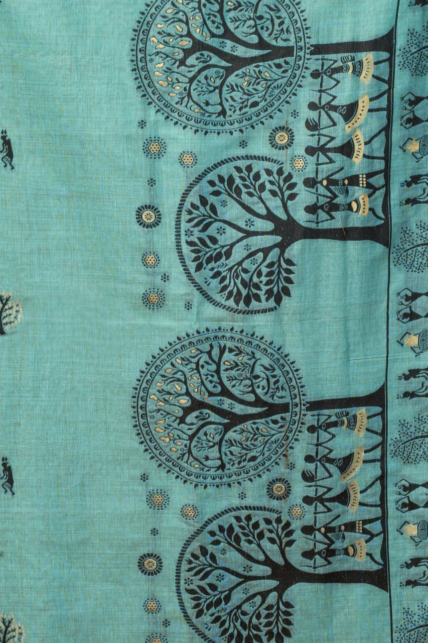 Teal fabric with black tree and people pattern