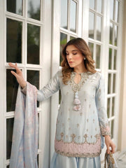 Designer sky blue satin silk suit with shimmering sequins showcased online