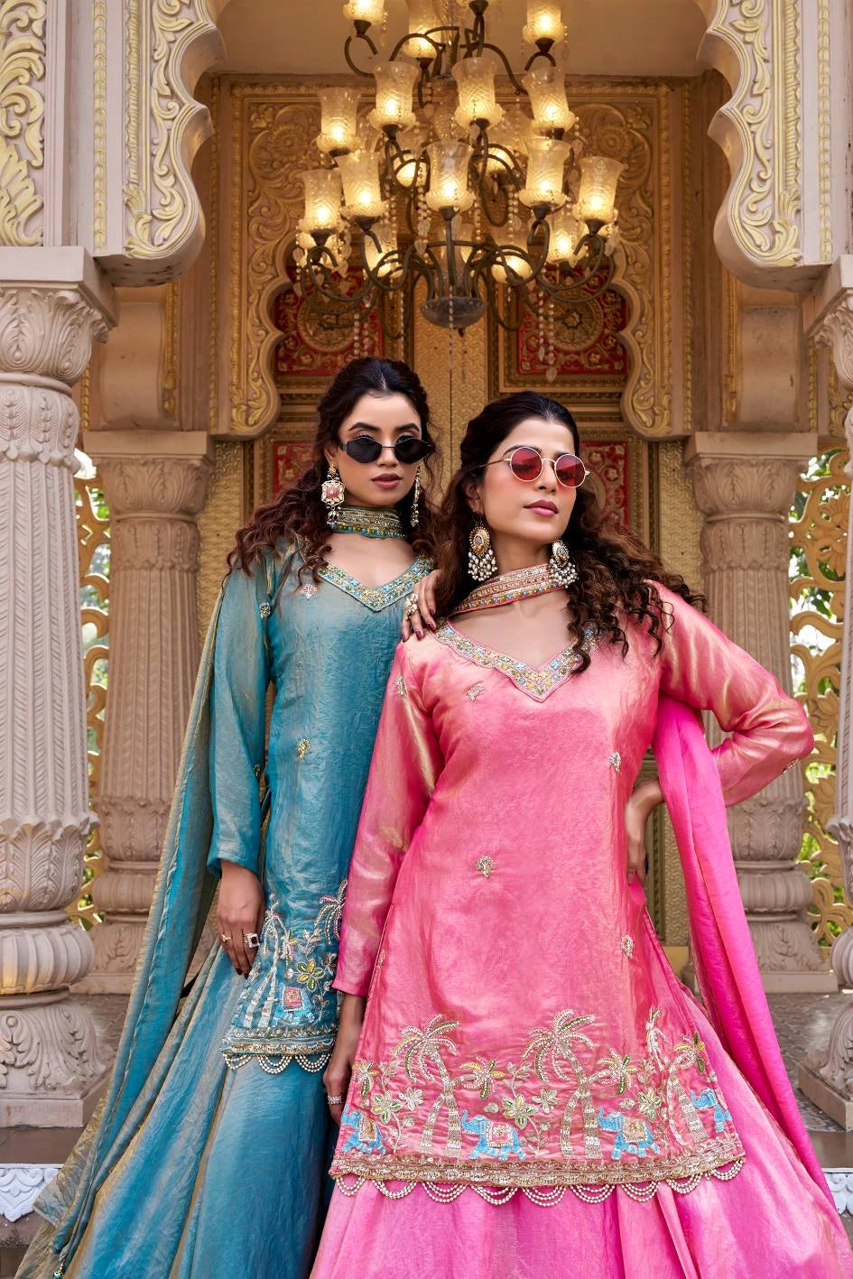 The soft blue fabric reflects light beautifully, adding richness to the outfit.
