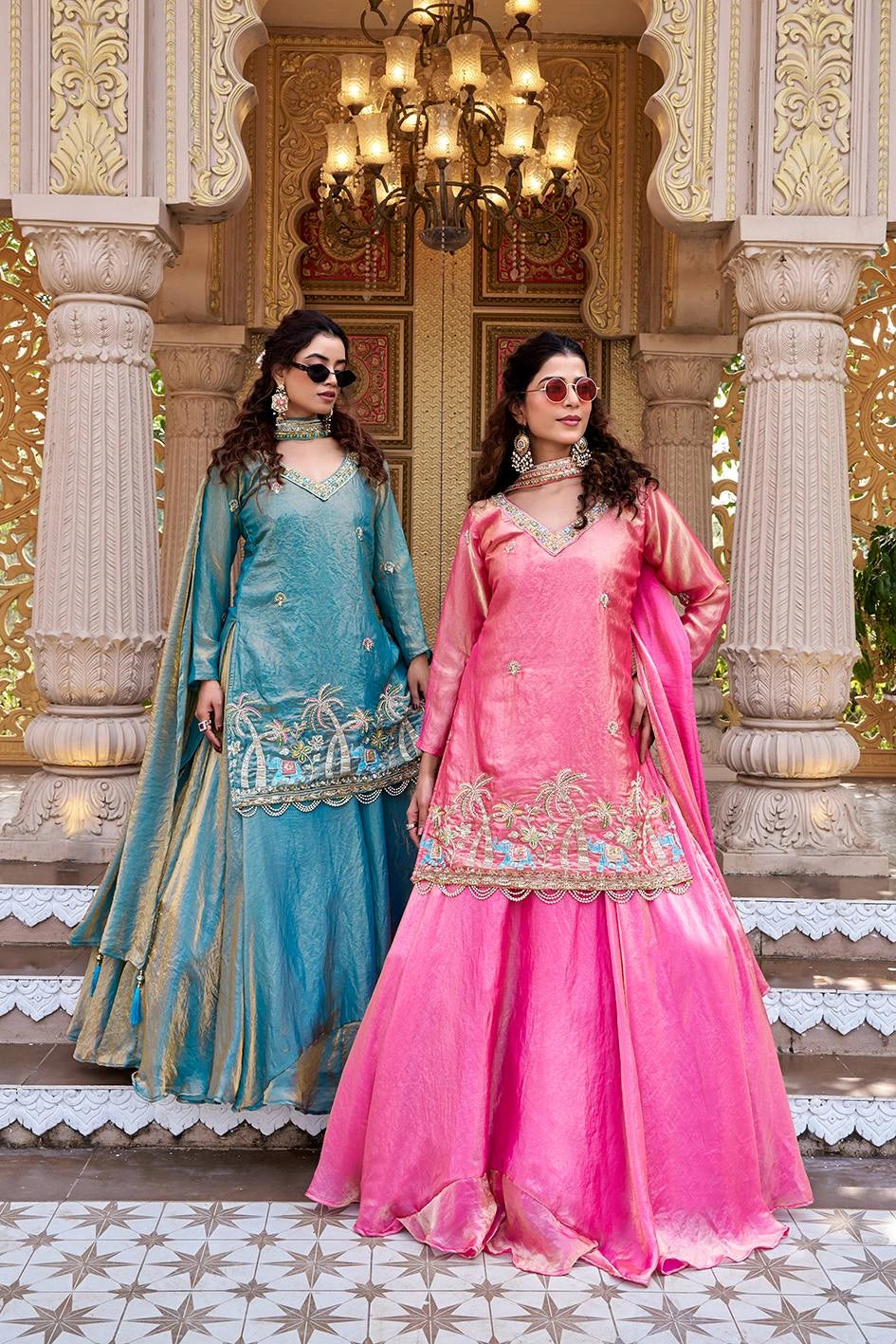 The combination of traditional attire and modern accessories creates a fashionable fusion style.

