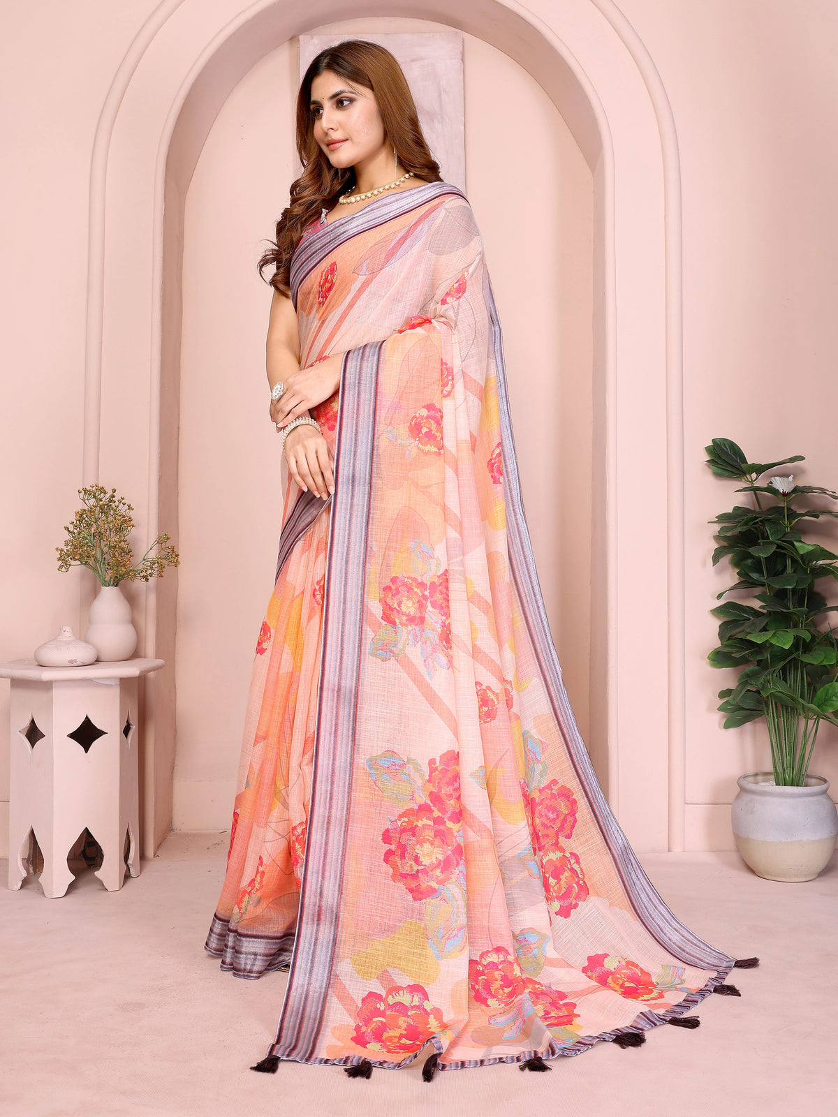 Side view of Soft Peach Digital Floral Print Linen Cotton Saree showing border and tassel trim