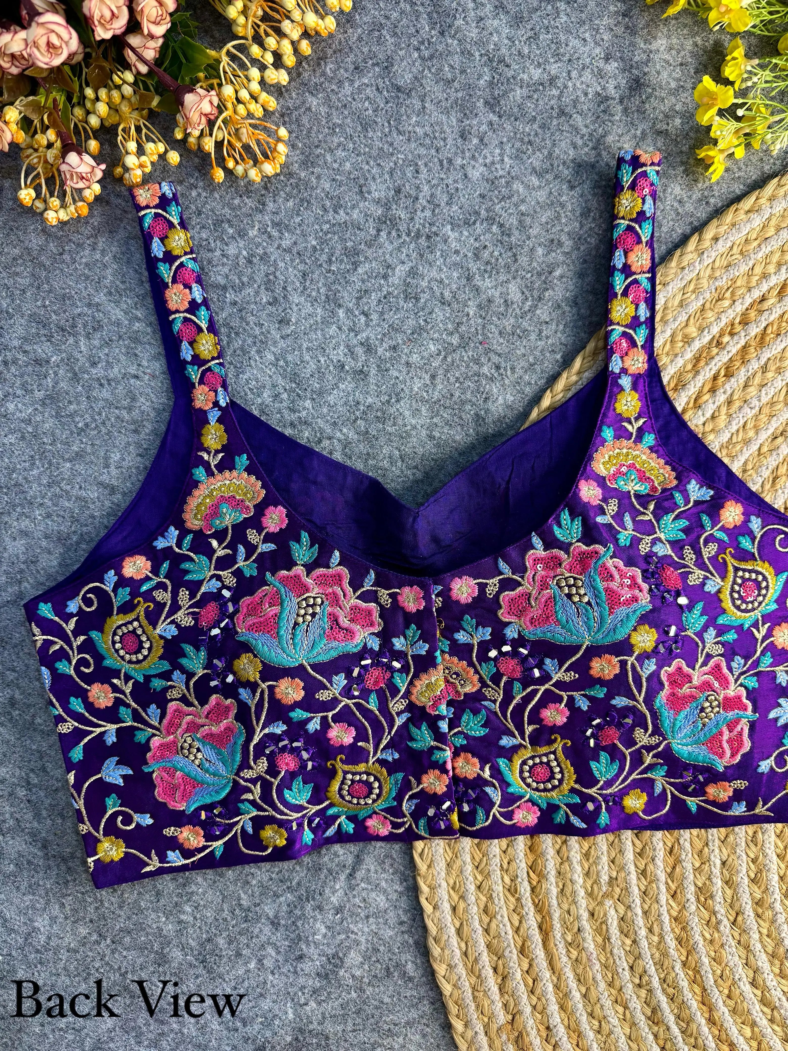 Soft purple silk blouse featuring delicate embroidery and intricate sequin work, perfect for festive and formal occasions.