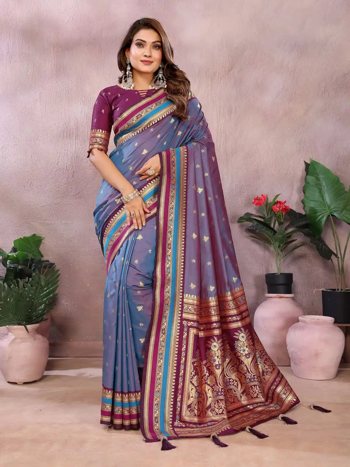 Woman wearing a colorful saree with a neutral background