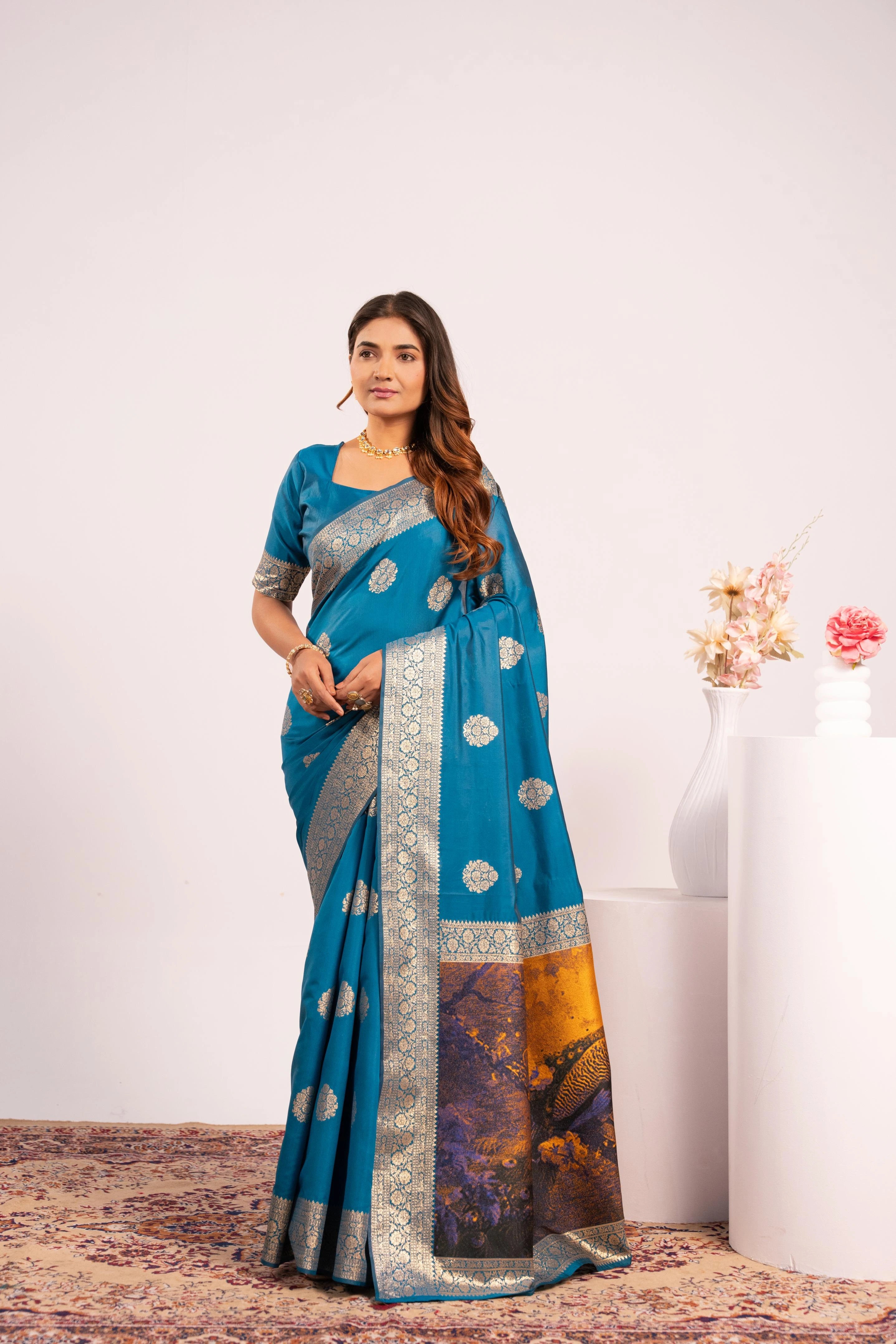Woman wearing a blue saree with a white background