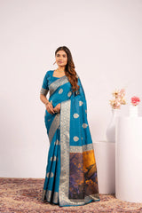 Woman wearing a blue saree with a white background