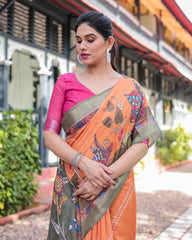 Woman wearing an orange saree with a green border outdoors.