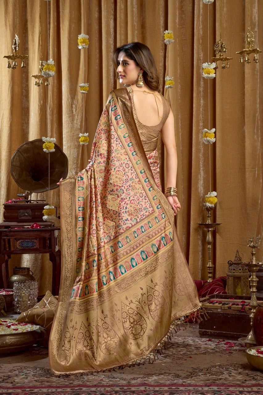 Woman in a traditional saree standing in a decorated room with ornate curtains and decor.