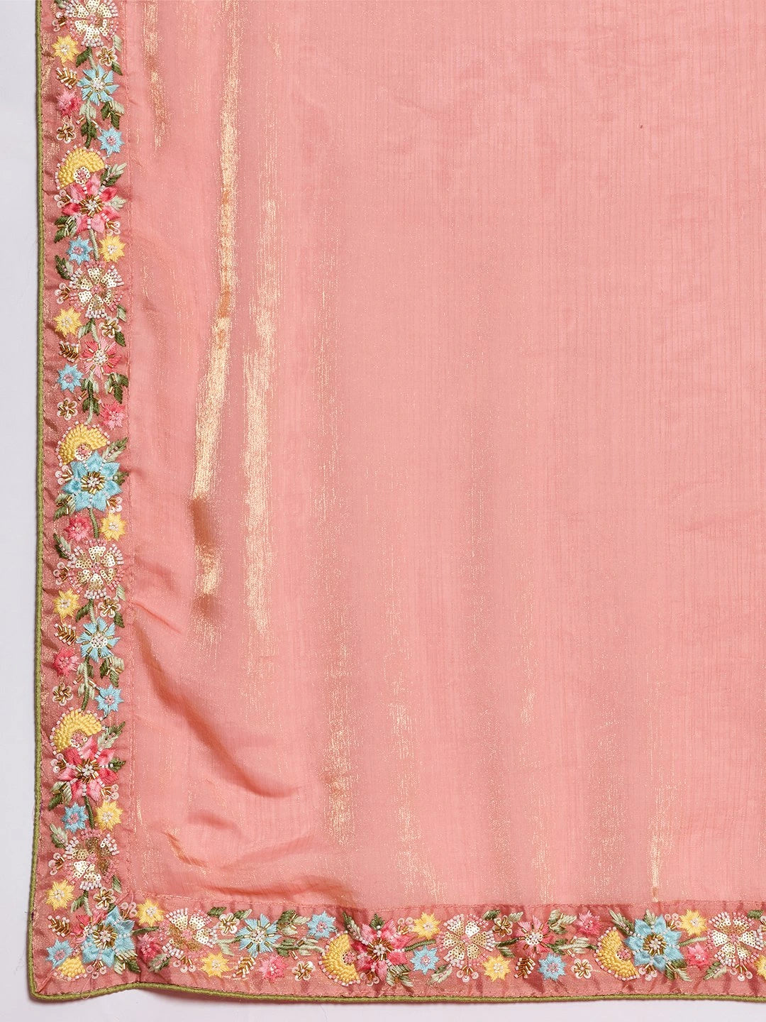 Pink fabric with floral embroidery and tassels on a white background