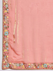 Pink fabric with floral embroidery and tassels on a white background