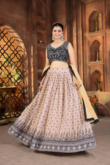 Woman in traditional outfit standing in a decorative indoor setting