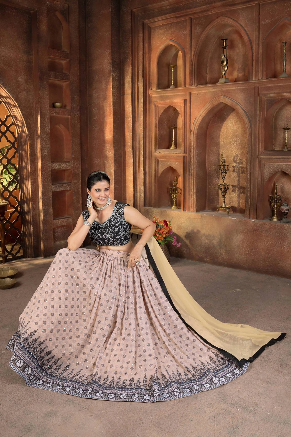 Woman in traditional outfit with a decorative background