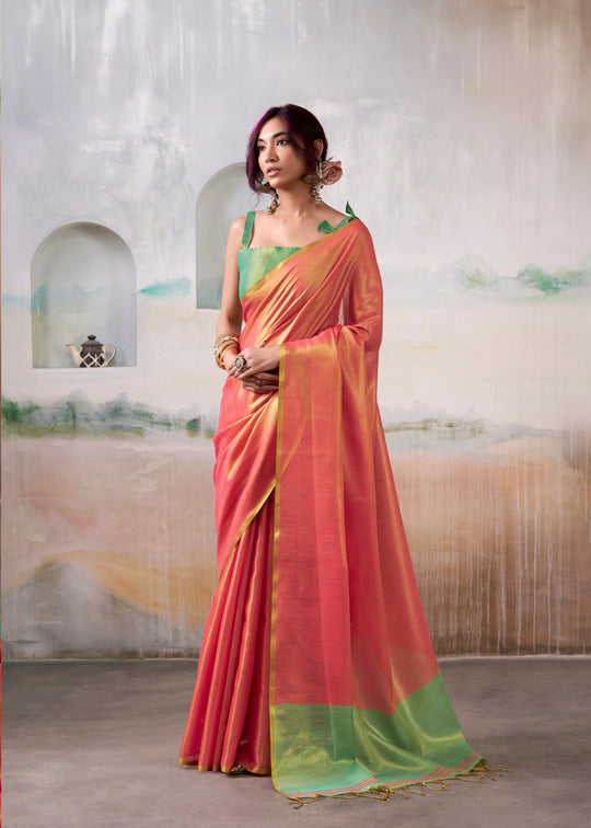 Woman wearing a vibrant saree with a colorful background