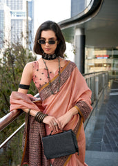 Woman in a traditional outfit with sunglasses and a black handbag in an urban setting