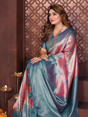 Woman wearing a colorful saree with a decorative background