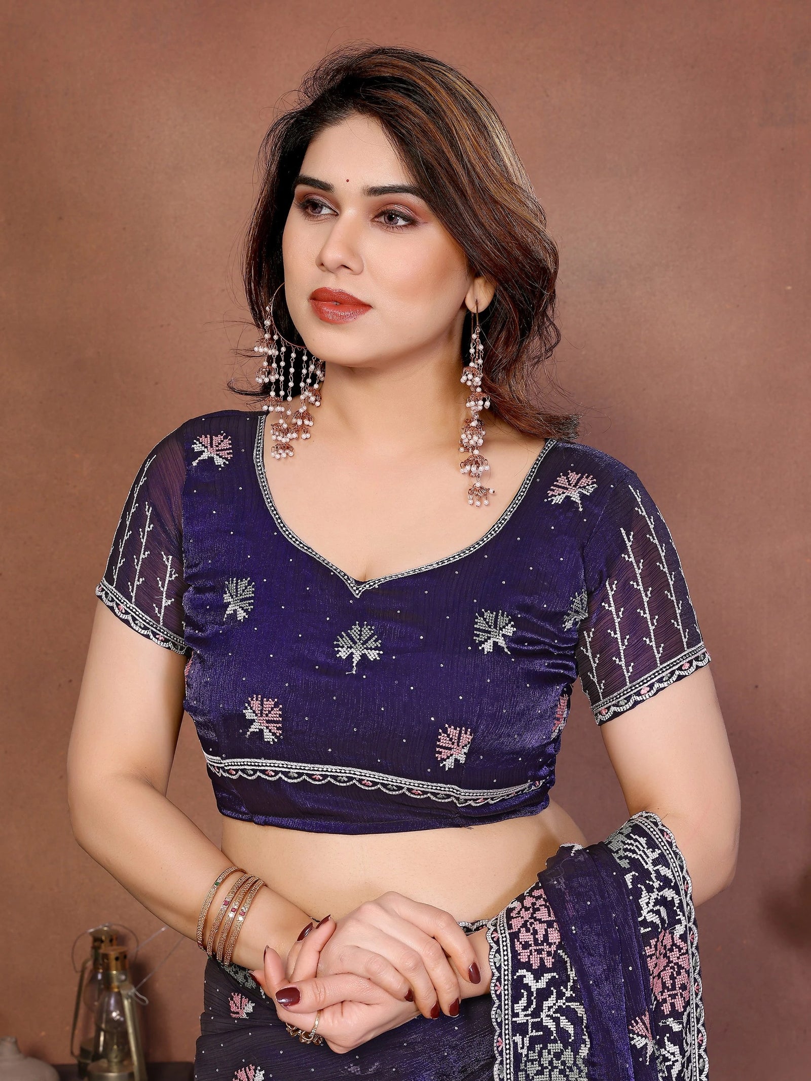 Soft purple embroidered Swarovski work chiffon silk saree with delicate Fendy design, shimmering border, and matching blouse piece — elegant attire for festive and wedding occasions