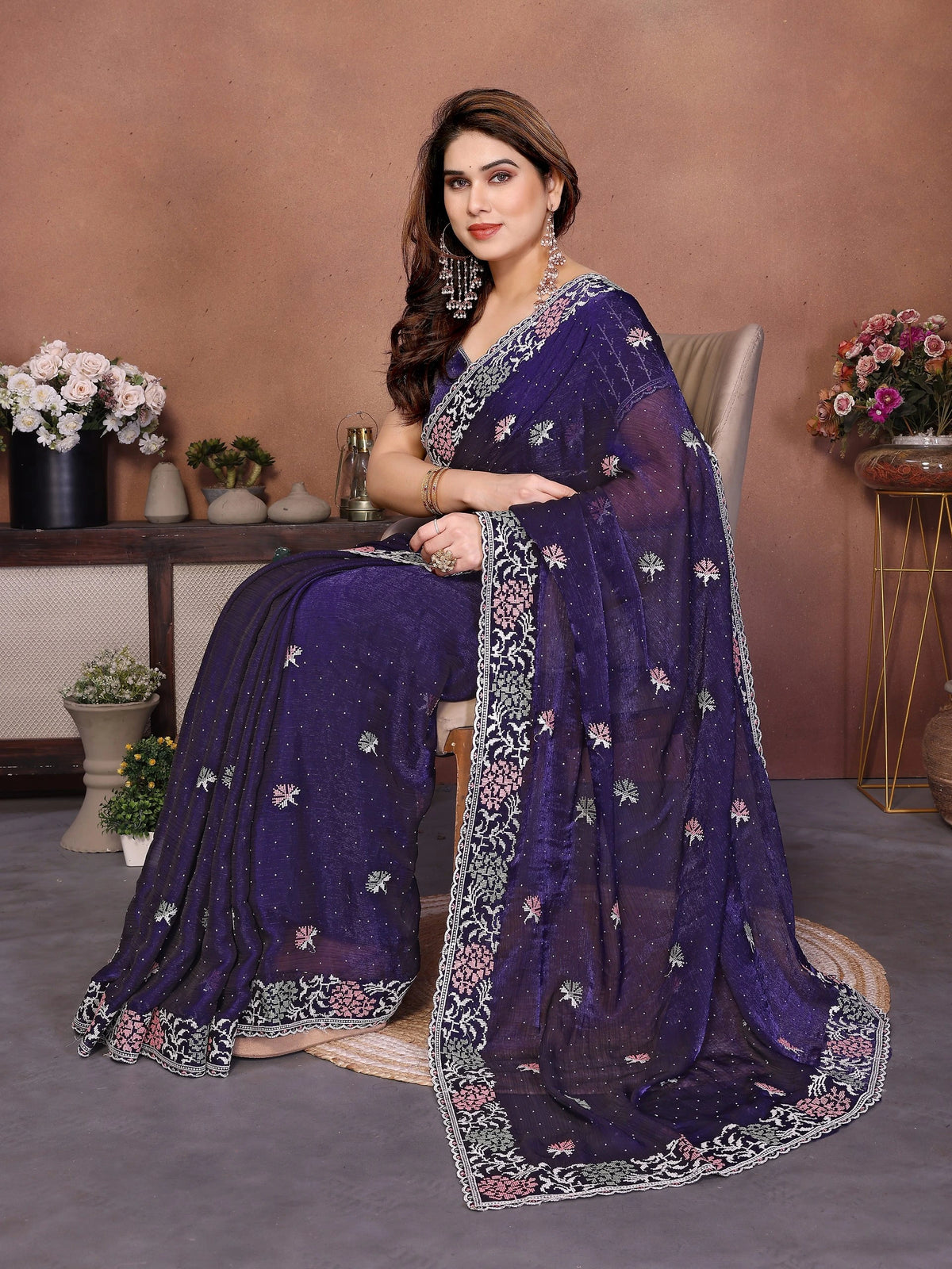 Ethereal soft purple saree in premium Fendy chiffon silk, adorned with intricate Swarovski embroidery and delicate cutwork border. Includes coordinated running blouse. Perfect for celebrations and special occasions.