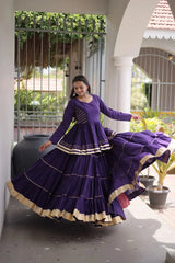 Women's Festive Purple Lehenga Dress with Layered Ghera, Golden Border Accents, and Timeless Ethnic Style
