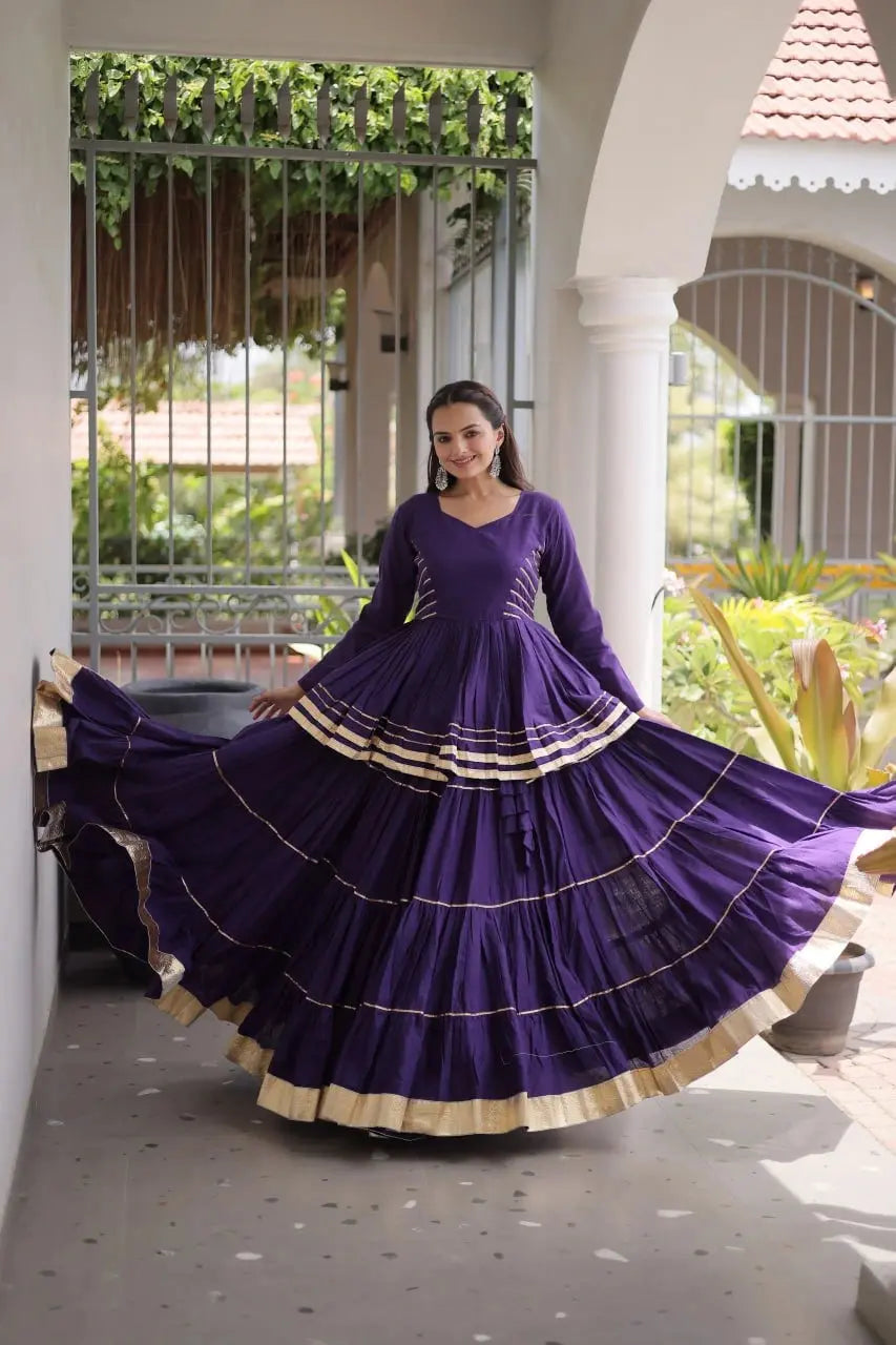 Gorgeous Purple Lehenga Set with Designer Peplum Top, Flowing Layers, and Festive Golden Border Finish