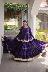 Gorgeous Purple Lehenga Set with Designer Peplum Top, Flowing Layers, and Festive Golden Border Finish