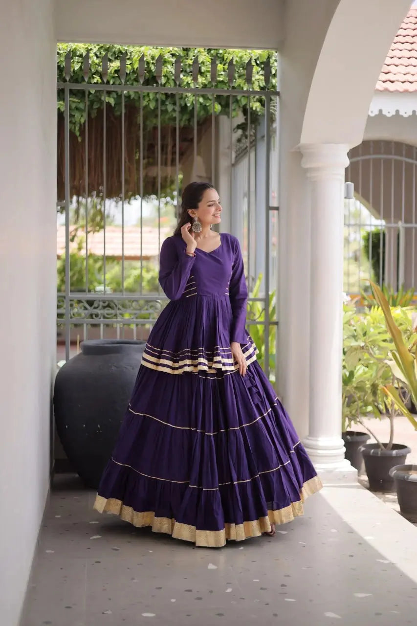 Premium Royal Purple Party Wear Lehenga with Tiered Design, Golden Trim, and Graceful Traditional Look
