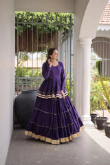 Premium Royal Purple Party Wear Lehenga with Tiered Design, Golden Trim, and Graceful Traditional Look