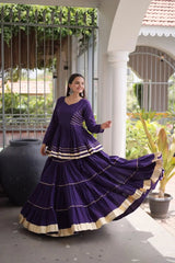 Festive Wear Purple Lehenga Set featuring Full Sleeve Blouse, Layered Skirt, and Elegant Gota Border