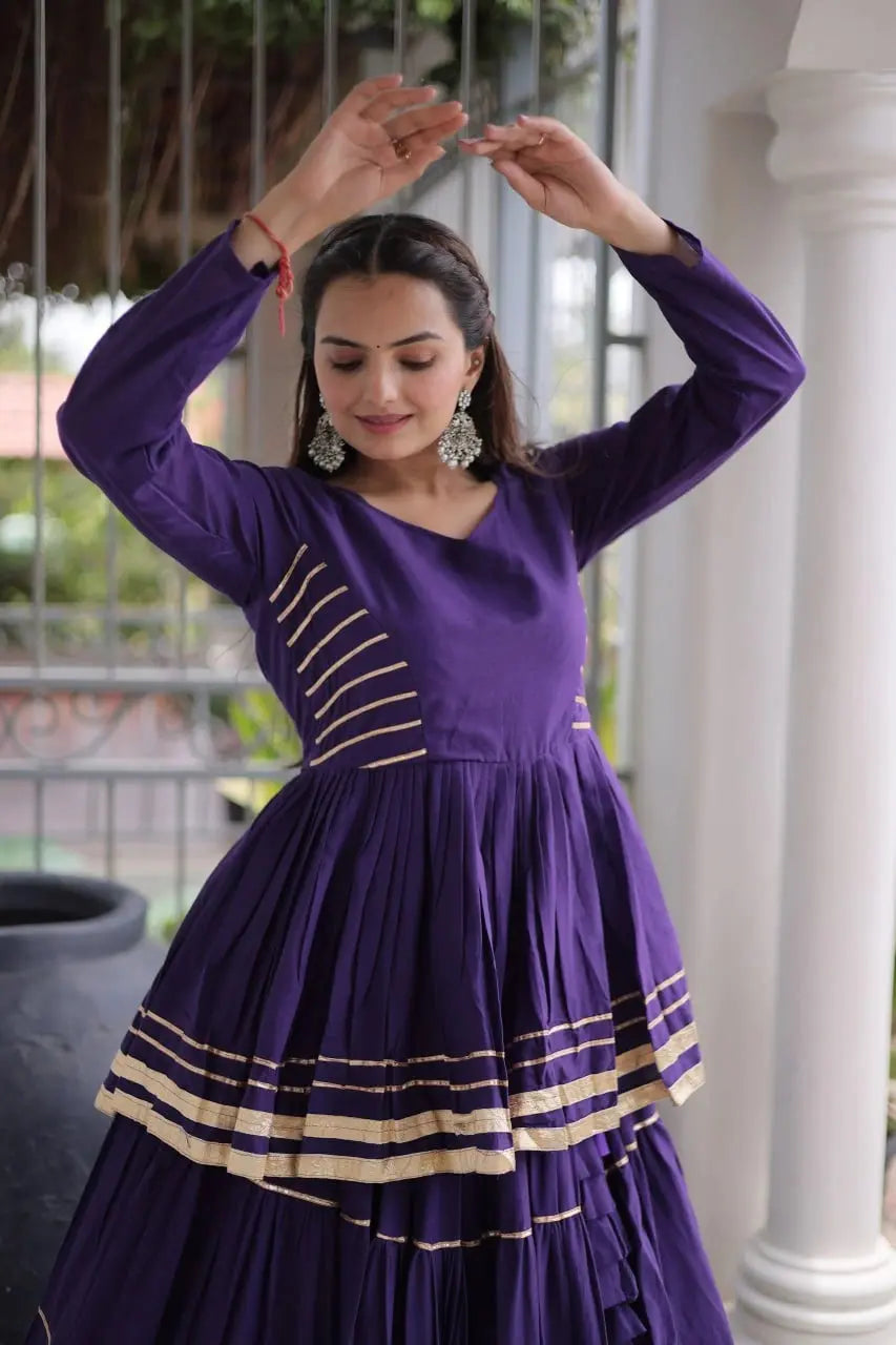 Designer Purple Lehenga Choli featuring Layered Flared Skirt, Peplum Style Top, and Golden Border Detailing