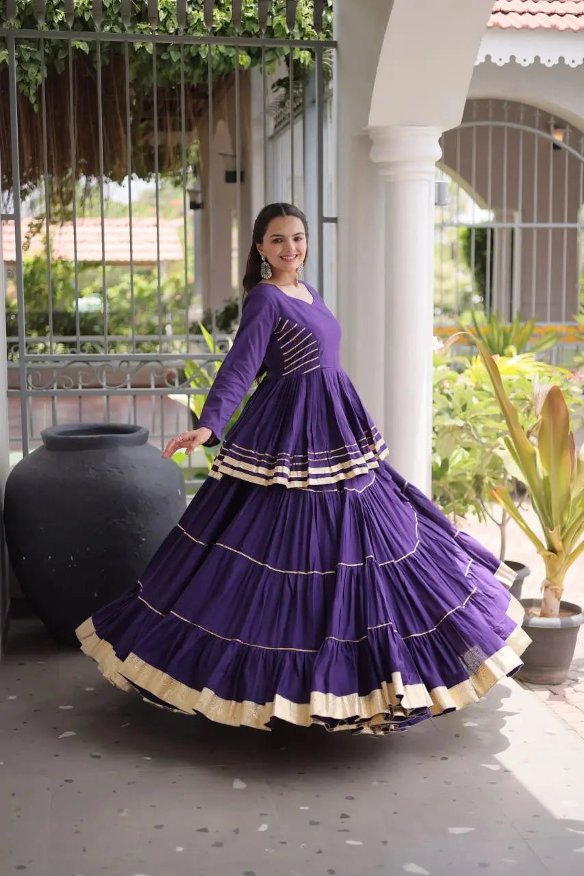 Traditional Purple Lehenga Outfit with Peplum Kurti, Broad Ghera, and Classic Golden Lace Work