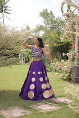 Premium purple party wear lehenga designed with luxurious detailing and elegant traditional craftsmanship.