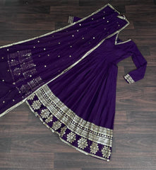 Purple saree with silver embroidery on a wooden surface