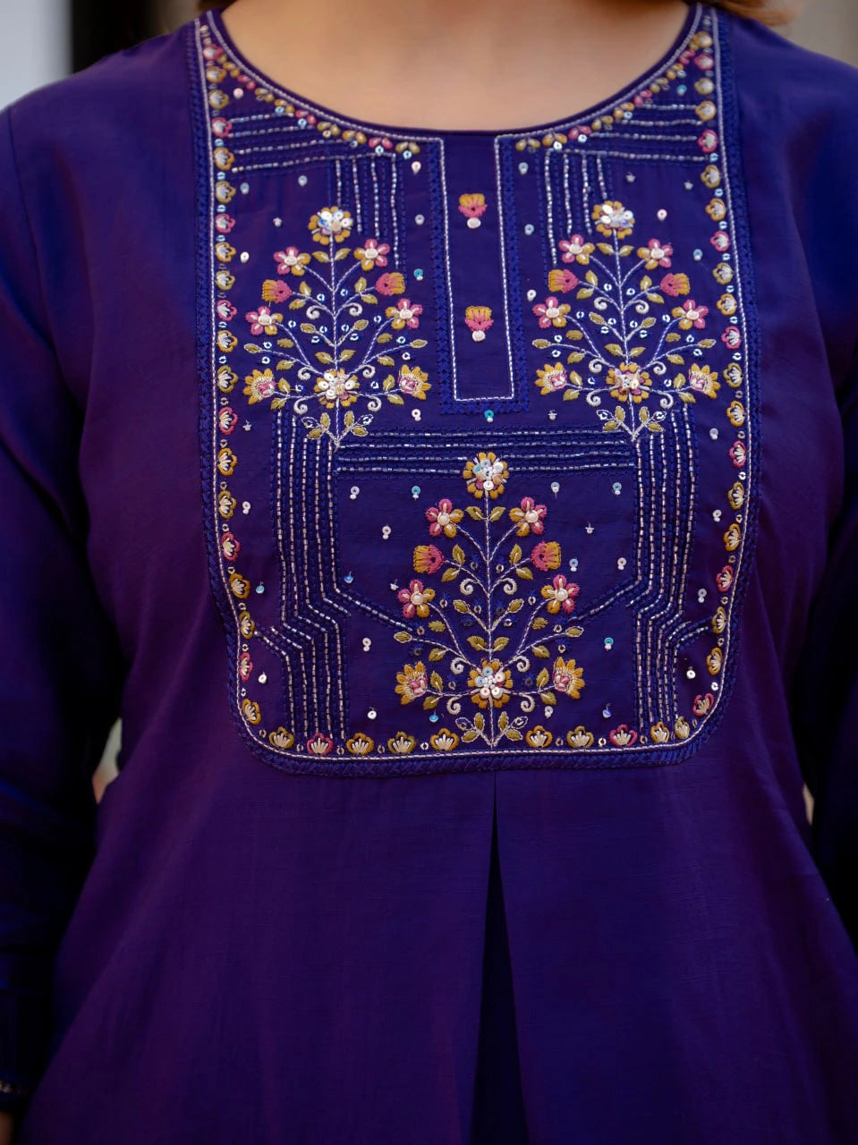 Purple garment with floral embroidery