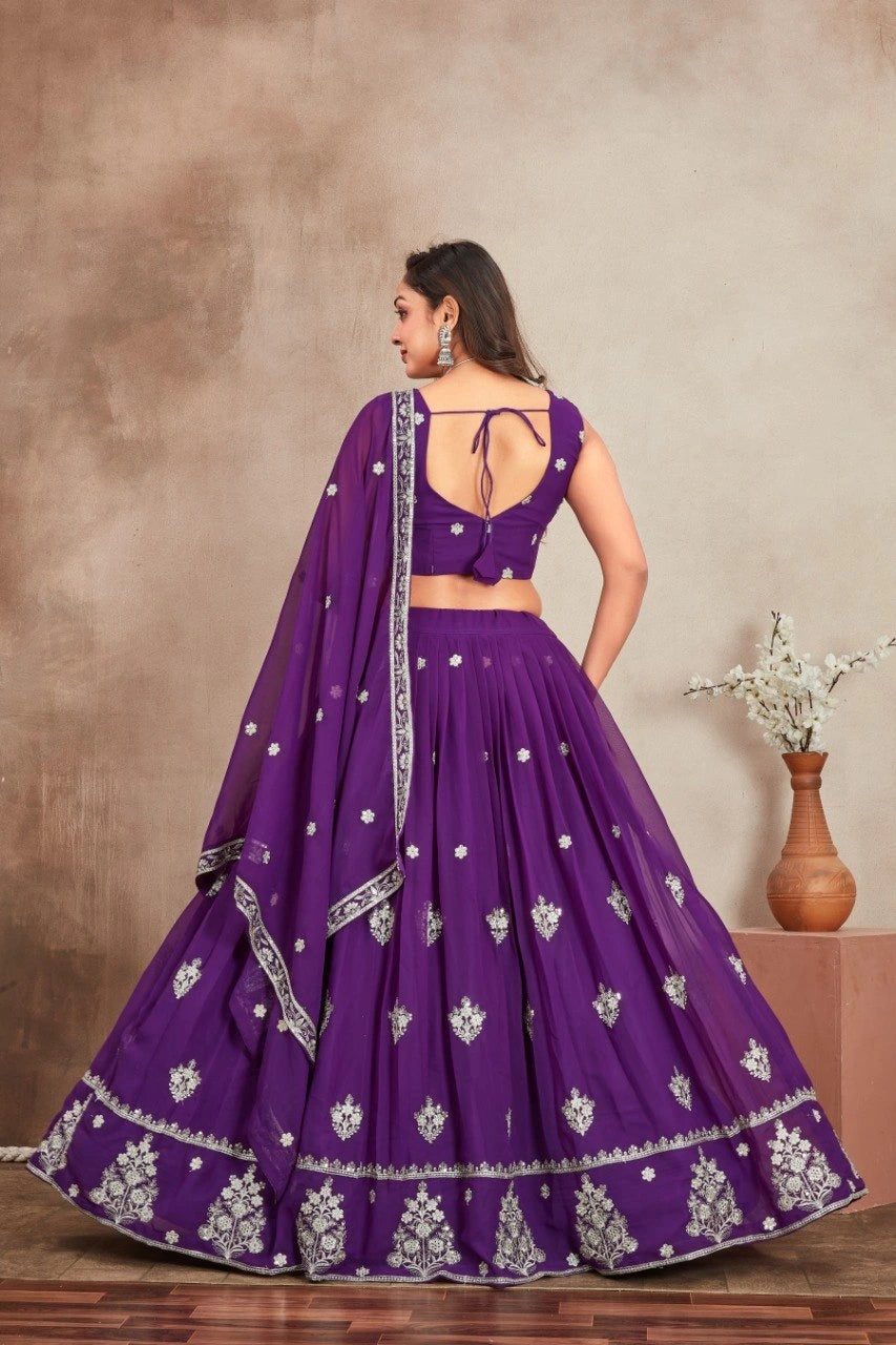 Purple traditional outfit with white patterns on a neutral background