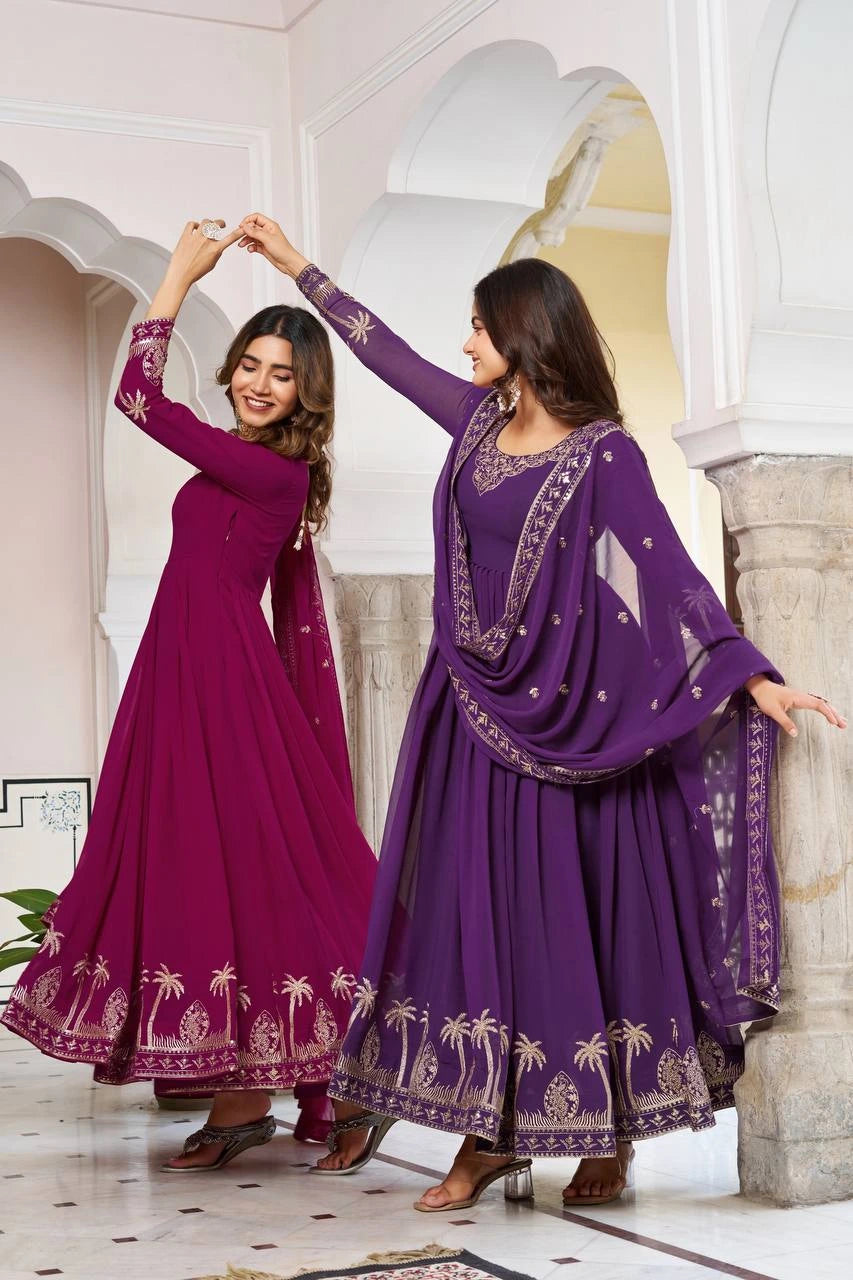 A candid-style shot of the two women twirling, highlighting the expansive flare and the lightweight, flowing drape of the Georgette fabric. Gold embroidery on the sleeves and hemlines catches the light.