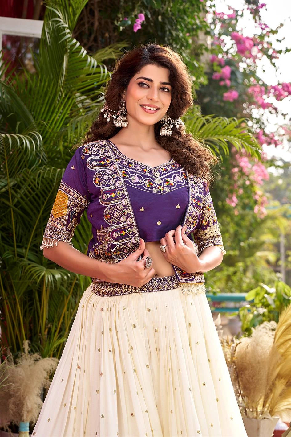 Woman in a purple and white traditional outfit with floral background