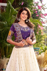 Woman in a purple and white traditional outfit with floral background