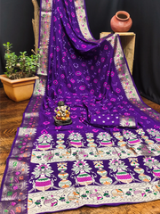 Purple saree with intricate patterns on a wooden surface