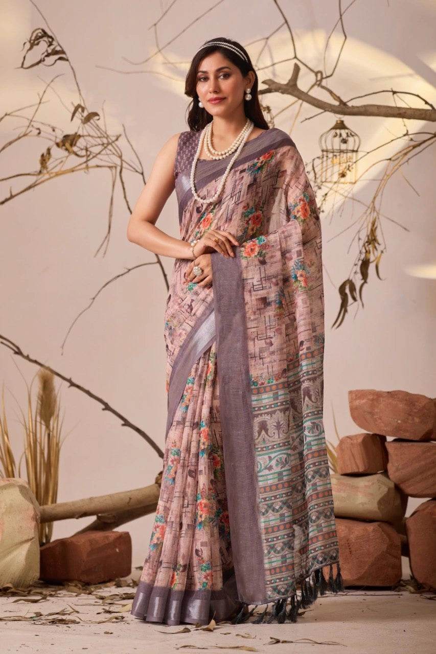 Woman wearing a traditional saree with a floral pattern in a rustic setting.