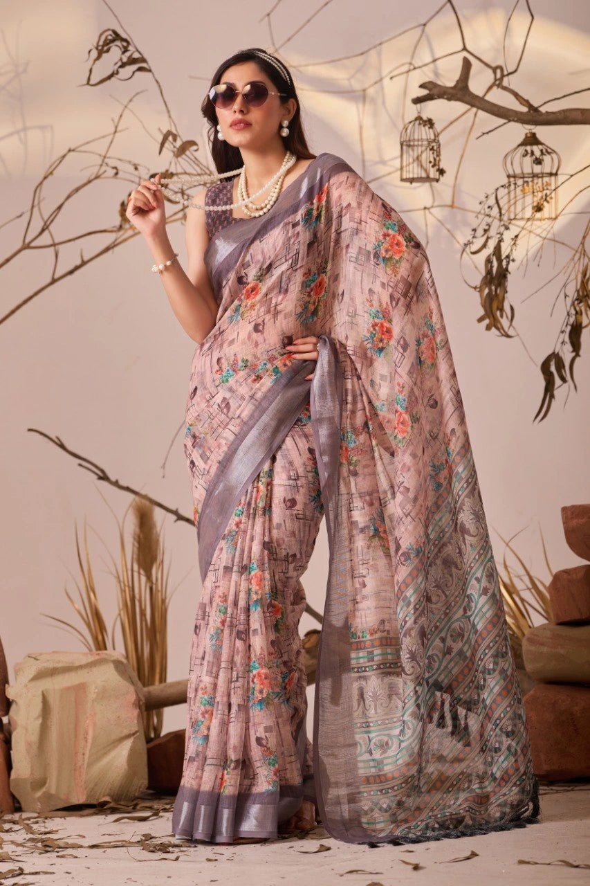 Woman in a floral saree standing against a neutral background with decorative elements.