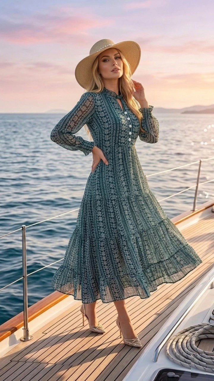 Woman in a green lace dress and sun hat on a boat at sunset
