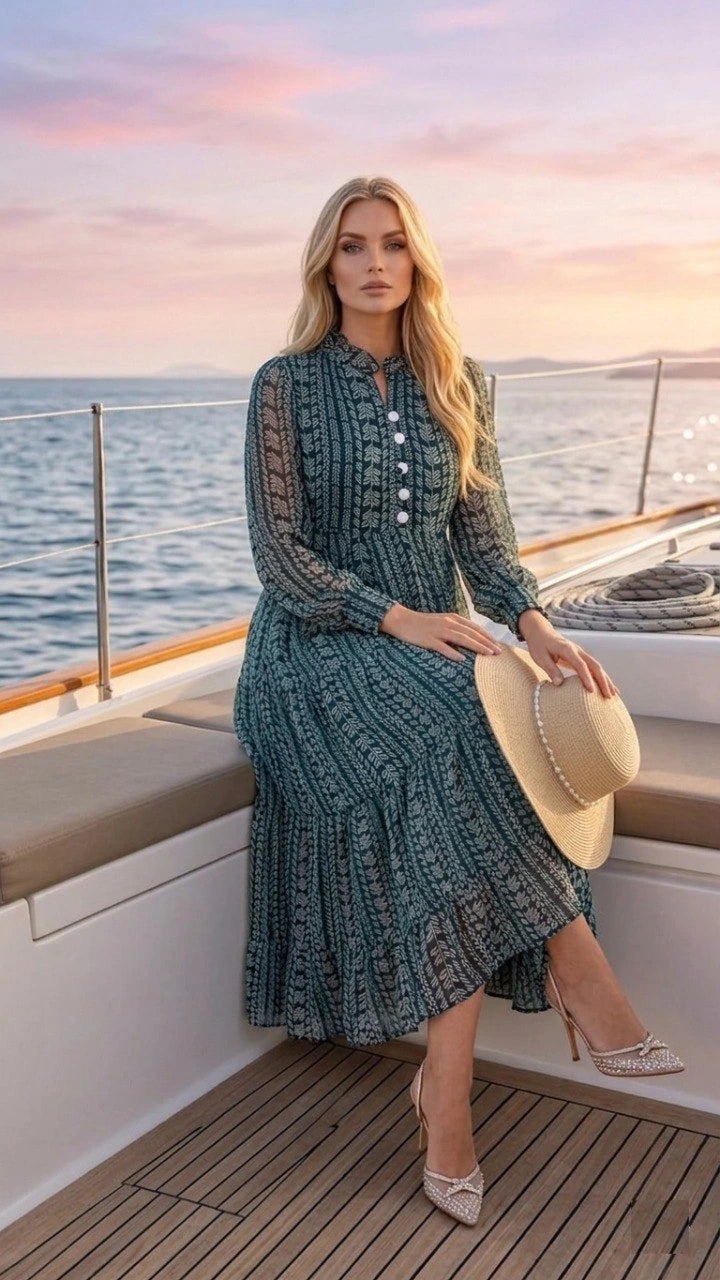 Woman in a teal dress on a boat with a sunset background