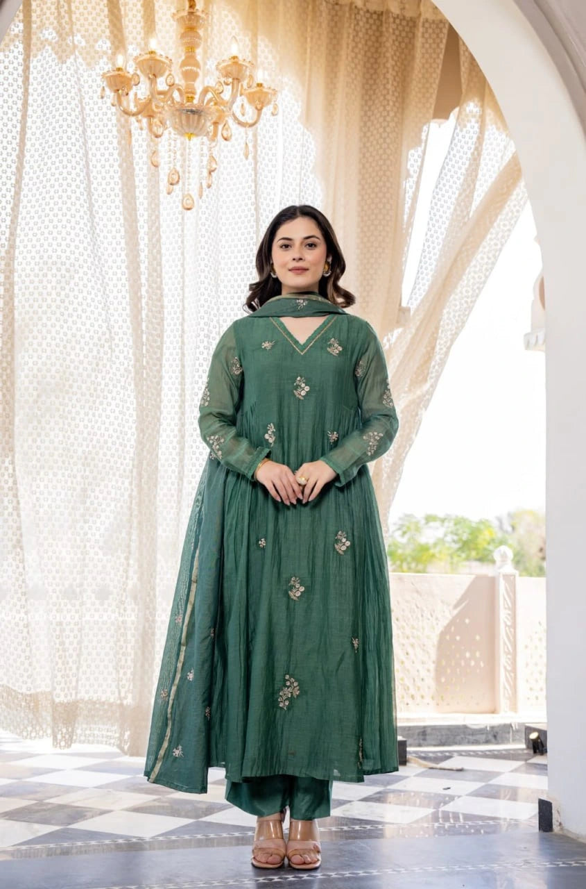 Beautiful bottle green embroidered Anarkali set designed with a flattering flared fit.
