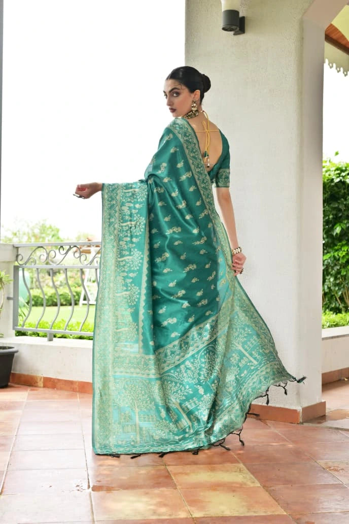 Woman wearing a green saree with a white background