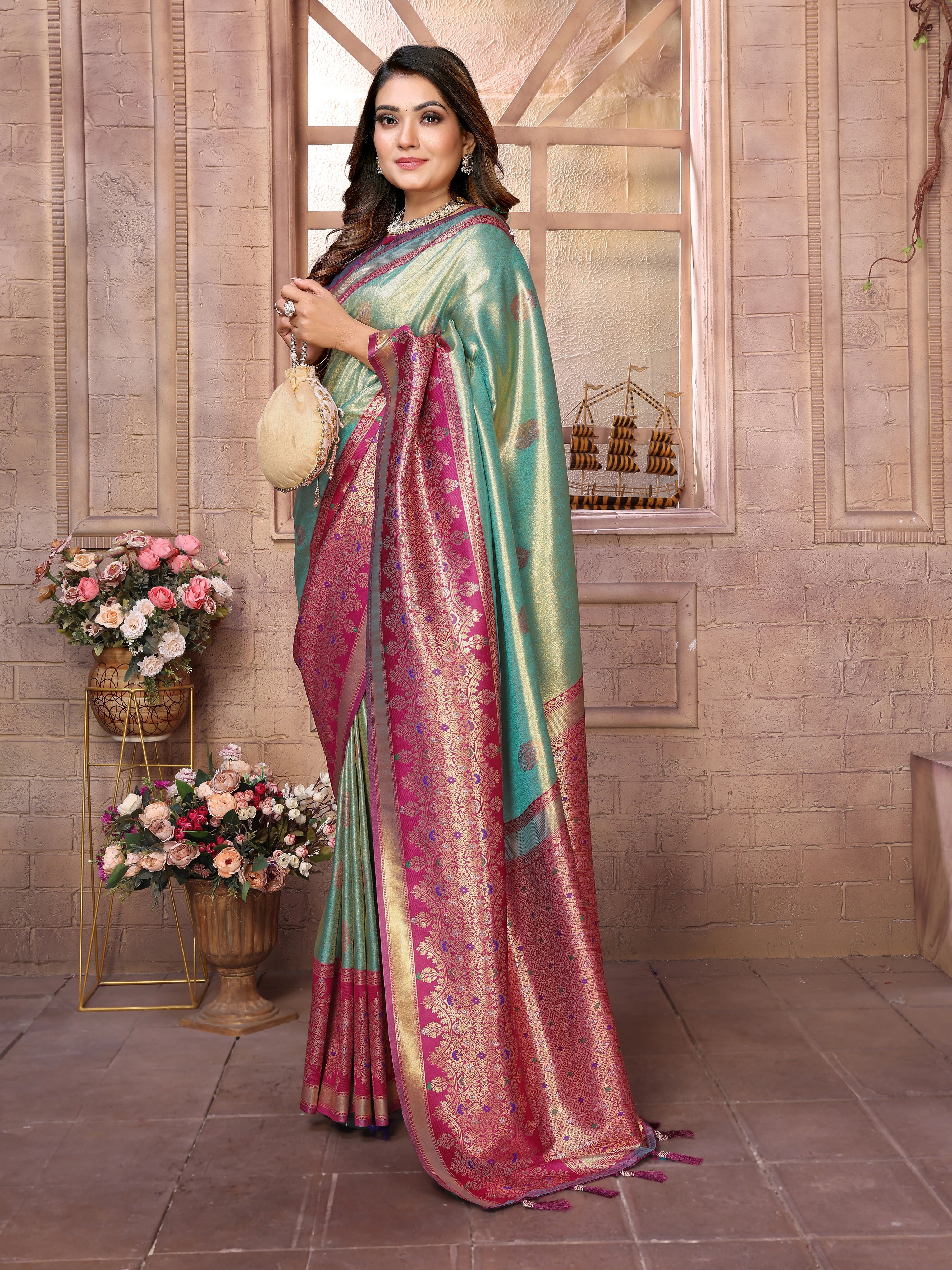 Woman wearing a traditional saree with a floral background