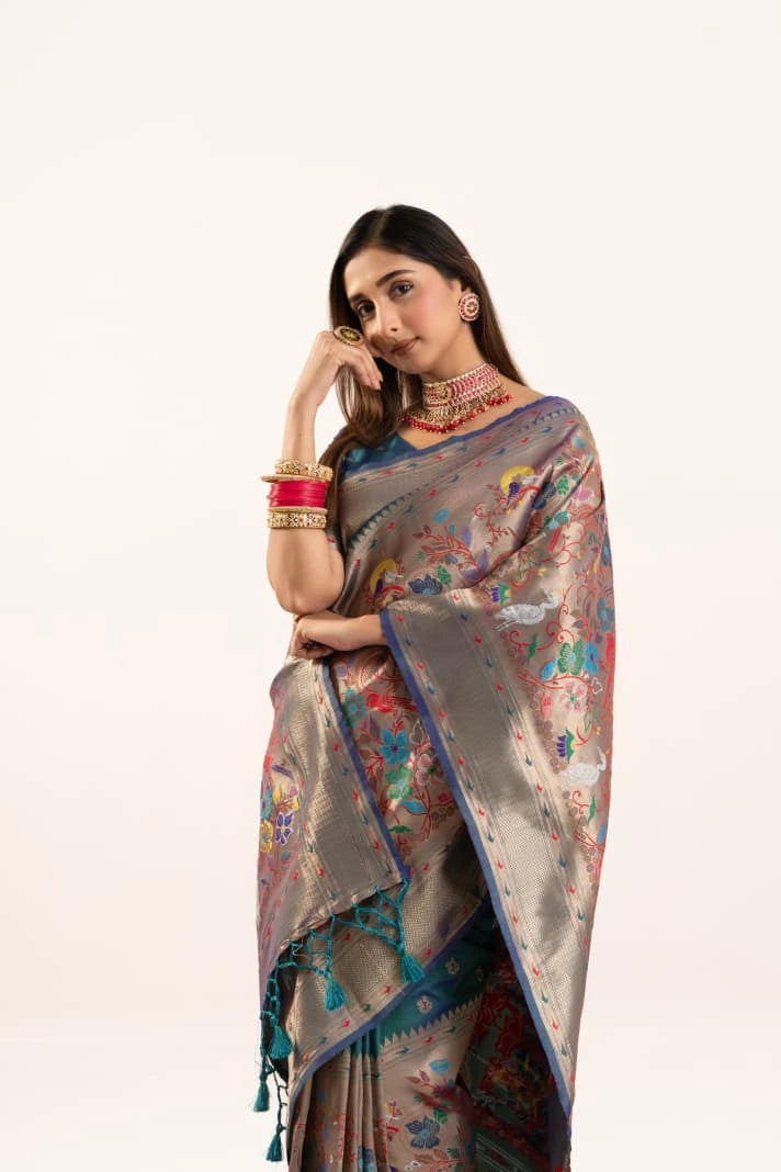 Woman wearing a floral saree with a white background